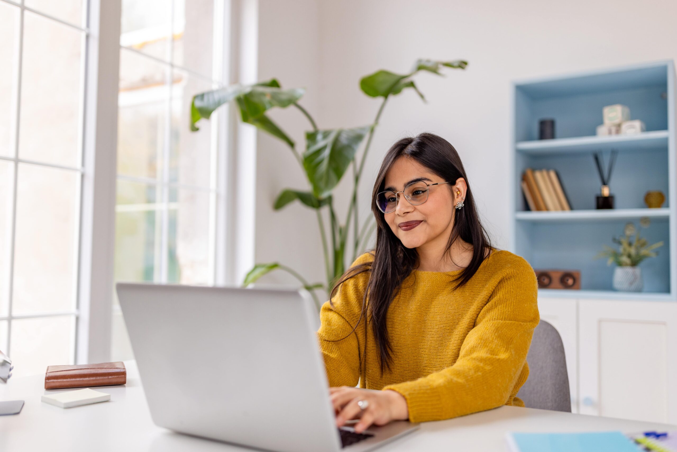 A southasian female using a laptop