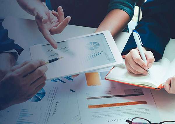 An accounts payable team reviewing data