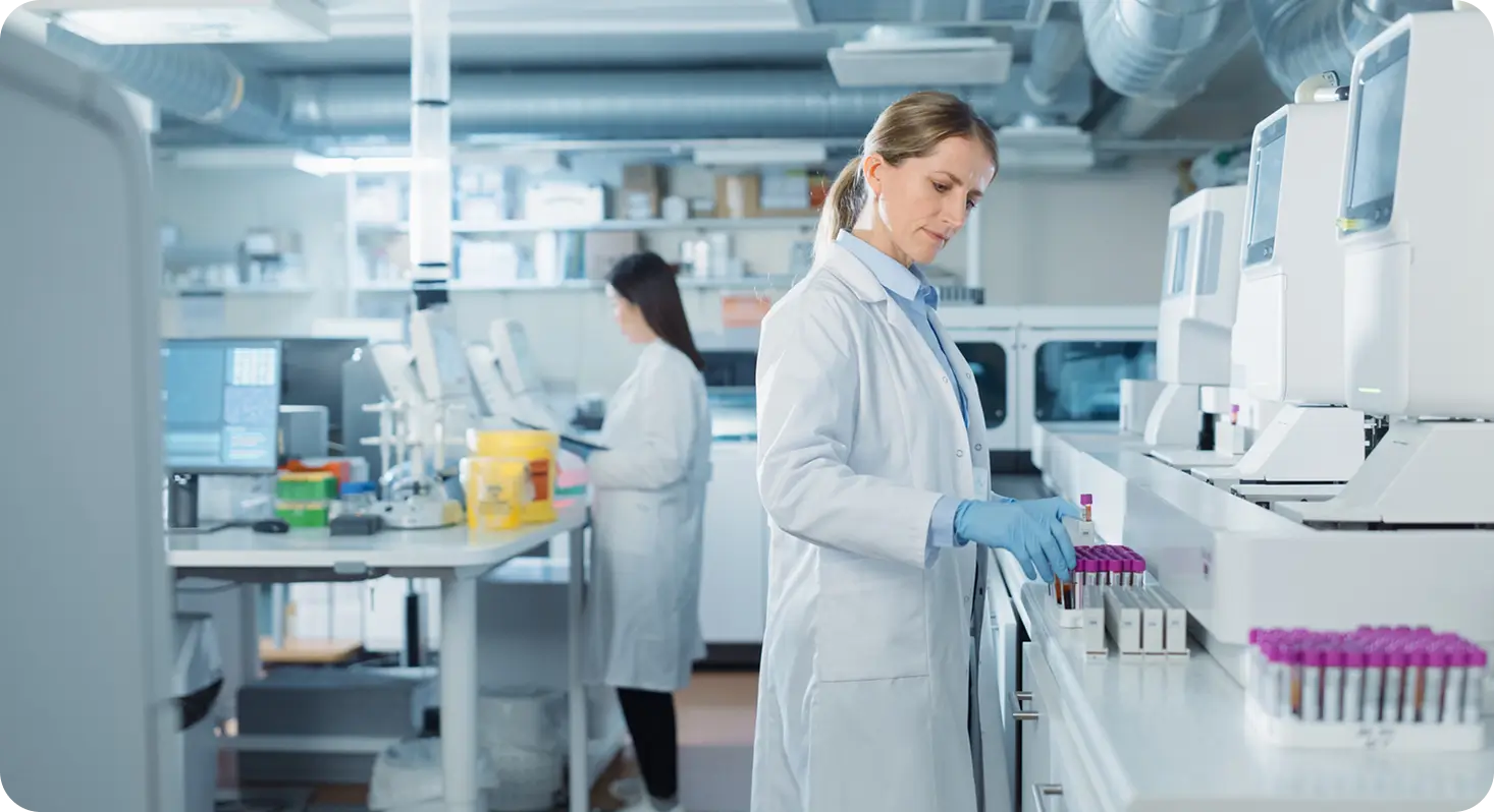 Two female lab technicians in the healthcare industry working in a lab