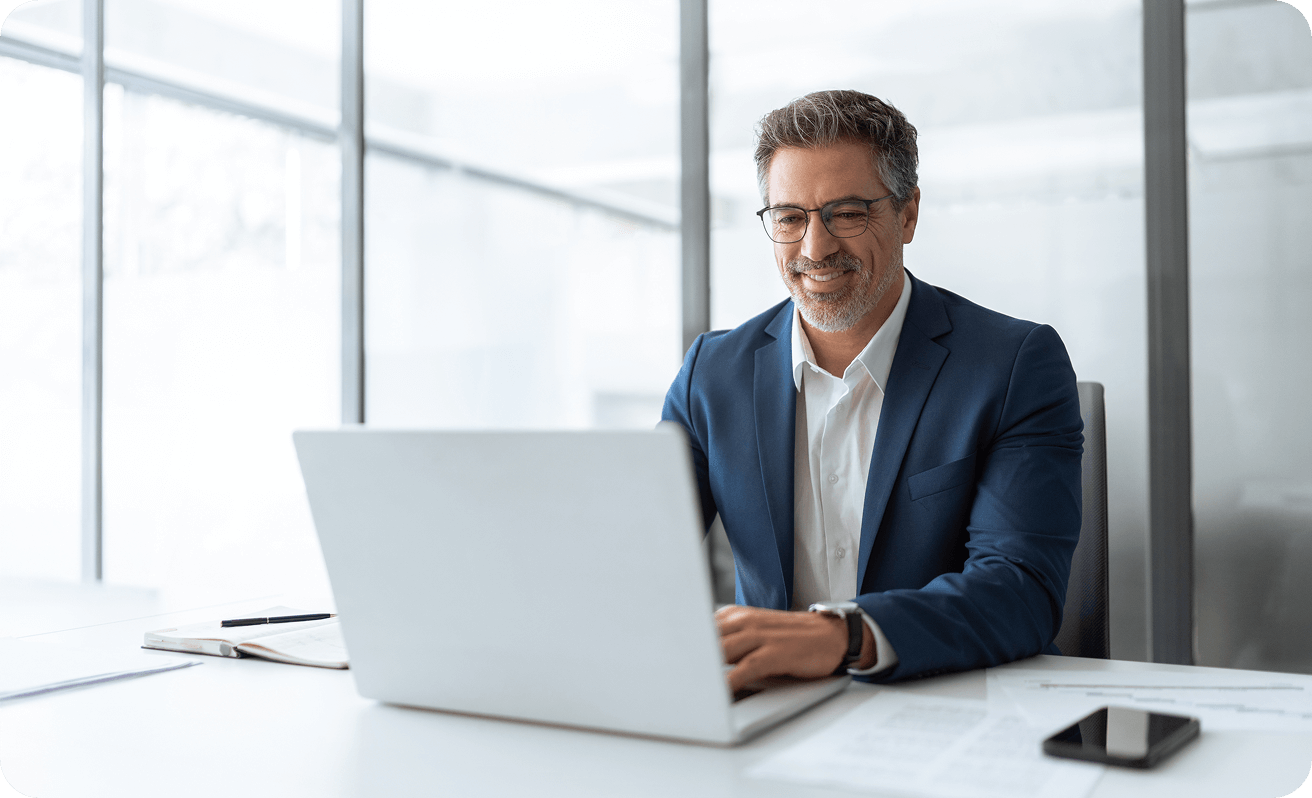 middle aged male professional using a laptop