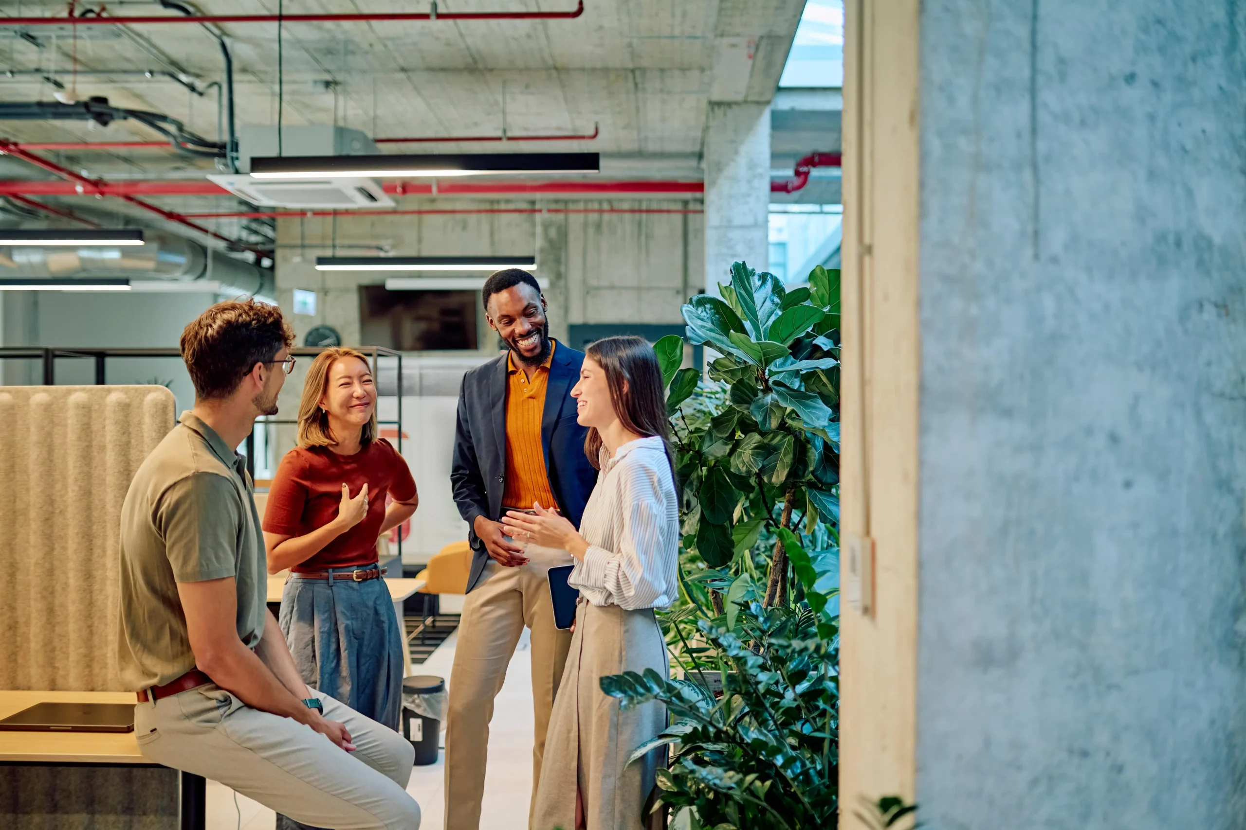 A team of work colleagues chatting about a project